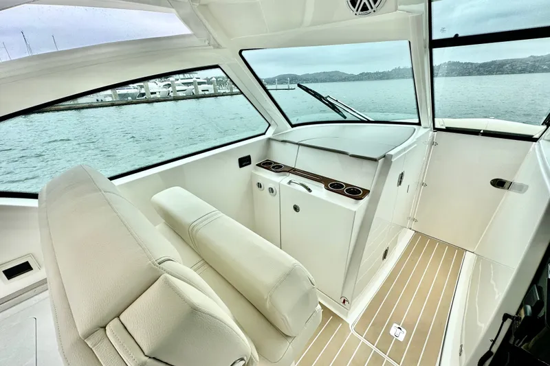 Slide: The Image of 2027 Tiara Yachts 34 LX interior with sleek design and waterfront view. - 19
