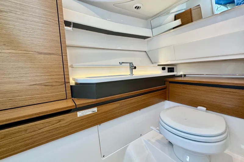 Slide: The Image of Modern bathroom interior of 2027 Tiara Yachts 34 LX, featuring sleek wood accents and elegant fixtures. - 40