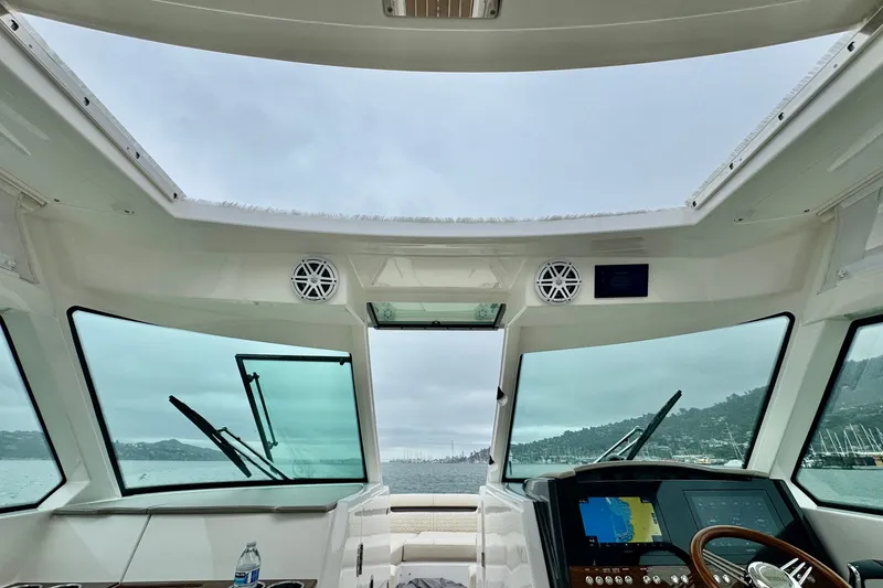 Slide: The Image of Interior view of 2027 Tiara Yachts 34 LX cockpit with navigation system and panoramic windows. - 20