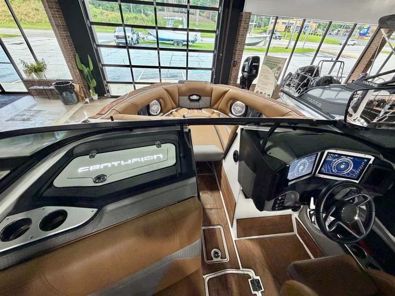 Slide: The Image of Interior of a 2022 Centurion Ri245 with brown leather seating and a modern dashboard. - 15