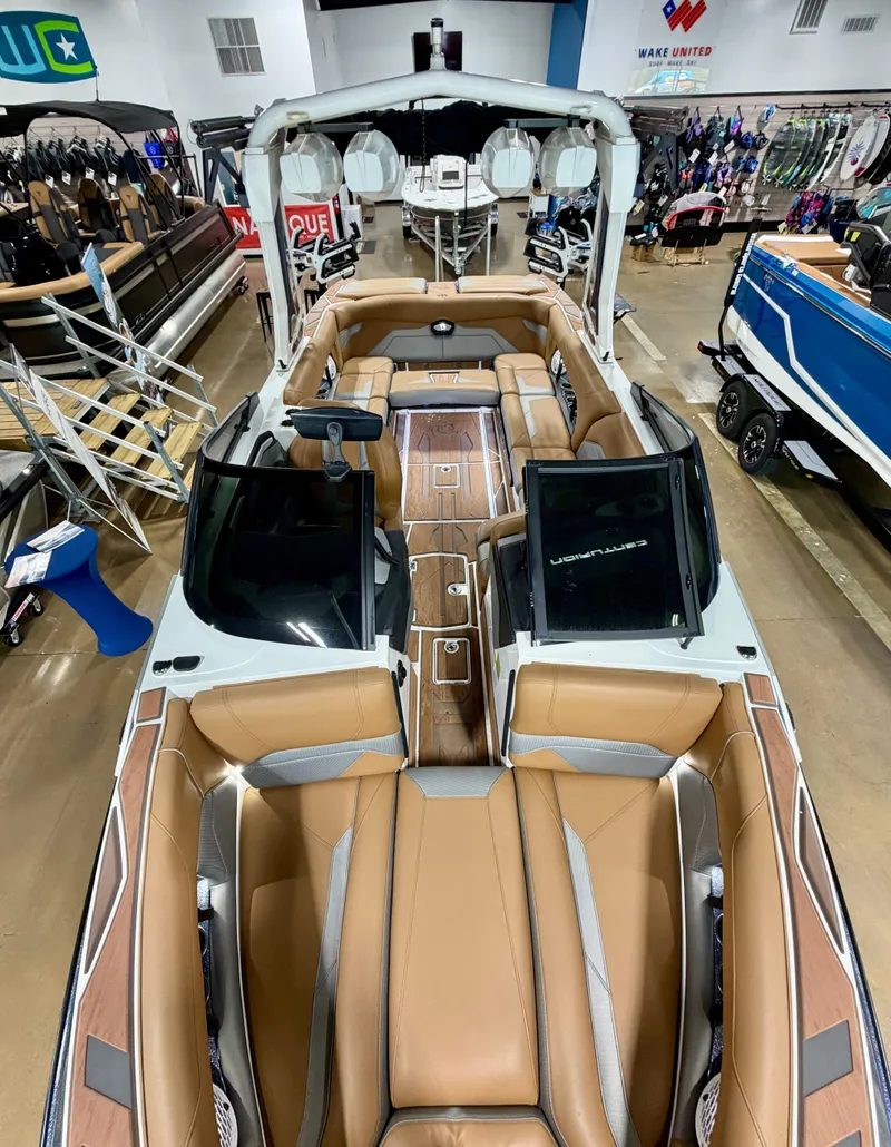 Slide: The Image of The image shows a luxurious 2022 Centurion Ri245 boat with elegant brown seating. - 16