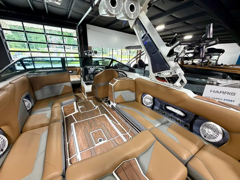 Slide: The Image of The image shows the interior of a 2022 Centurion Ri245 with brown leather seats and modern speakers. - 10