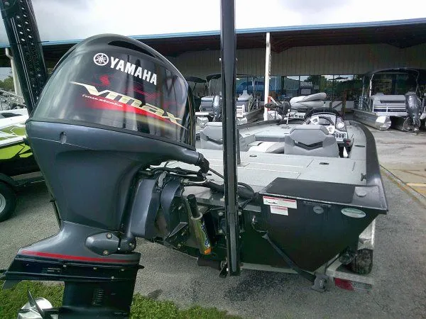 Slide: The Image of A 2022 G3 Sportsman 1810 boat with a Yamaha outboard motor, parked on a trailer. - 4