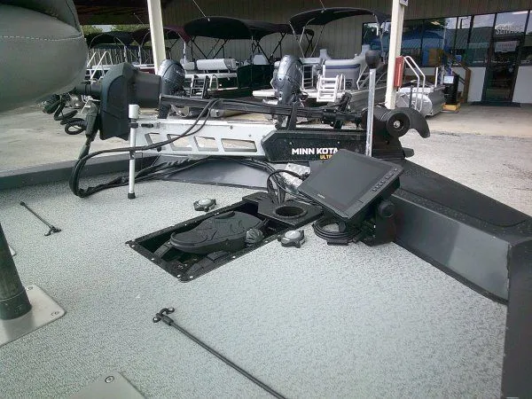 Slide: The Image of The image shows the deck of a G3 Sportsman 1810 boat with a Minn Kota motor. - 2