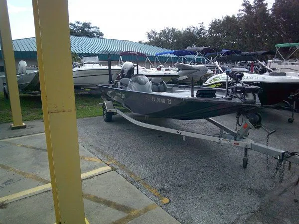 Slide: The Image of A gray 2022 G3 Sportsman 1810 boat on a trailer in a parking area. - 7