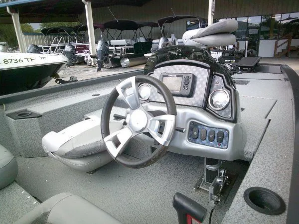 Slide: The Image of The image shows the cockpit of a 2022 G3 Sportsman 1810 boat with a modern helm. - 3