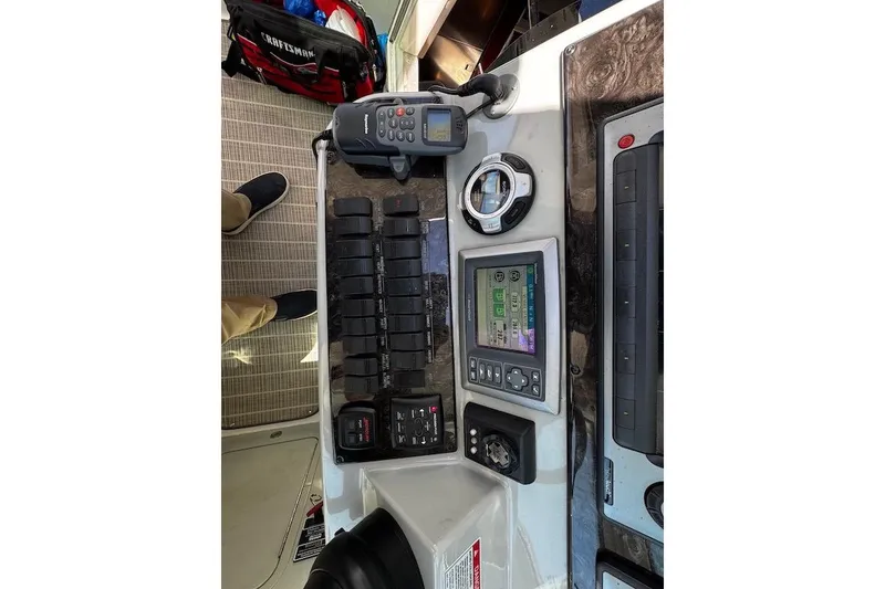Slide: The Image of Control panel of a 2010 Sea Ray 470 Sundancer boat with navigation equipment. - 15