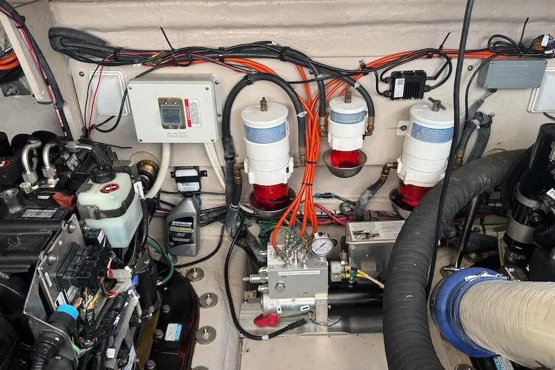Slide: The Image of Engine room of a 2010 Sea Ray 470 Sundancer with visible wiring and components. - 9