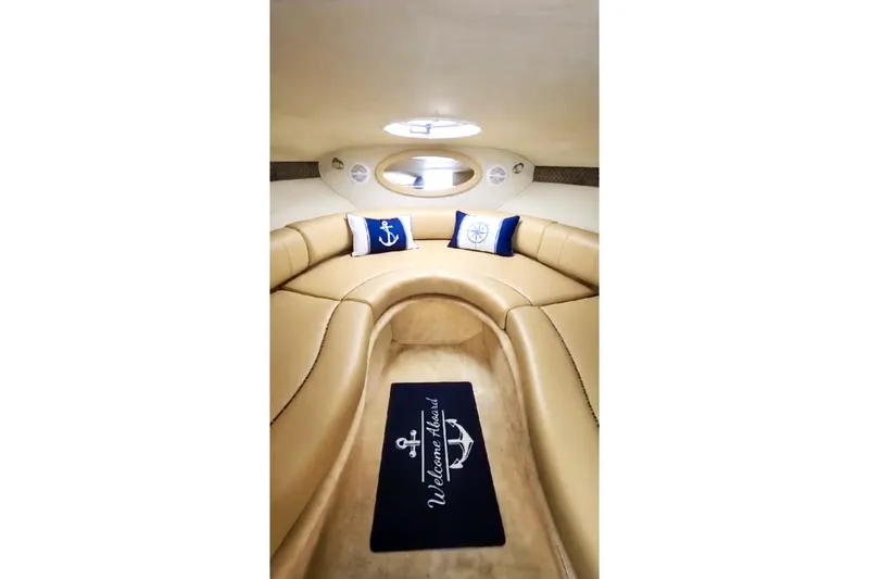 Slide: The Image of Interior of 2006 Monterey 298SC Super Sport boat with beige seating and nautical decor. - 9