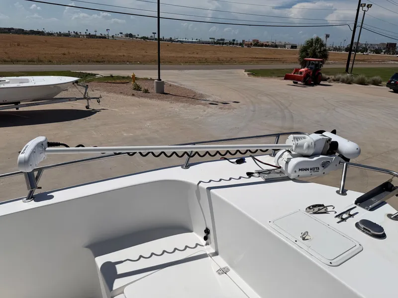 Slide: The Image of A 2002 PRO SPORT PRO KAT 2200 with a Minn Kota trolling motor on the deck. - 13