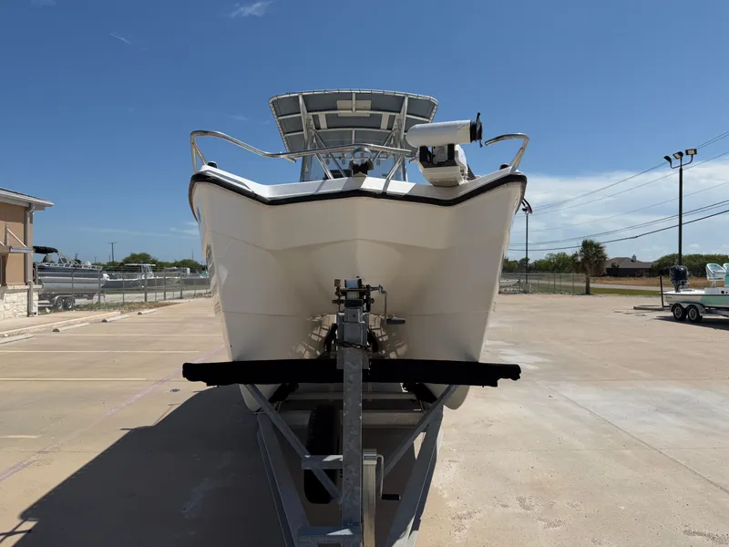 Slide: The Image of A 2002 PRO SPORT PRO KAT 2200 boat on a trailer, ready for transport. - 5