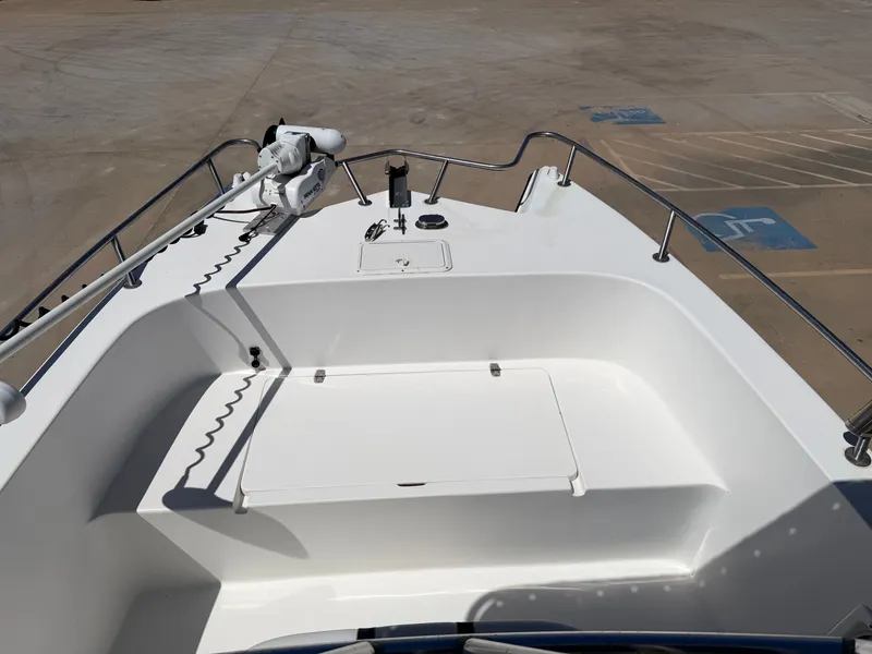 Slide: The Image of The image shows the bow deck of a 2002 PRO SPORT PRO KAT 2200 boat. - 12