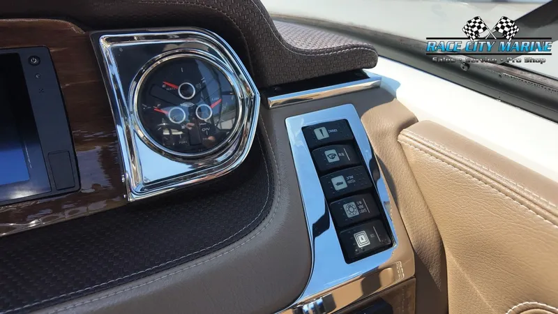 Slide: The Image of Close-up of a 2015 Chaparral 277 SSX dashboard with sleek controls and a tachometer. - 25