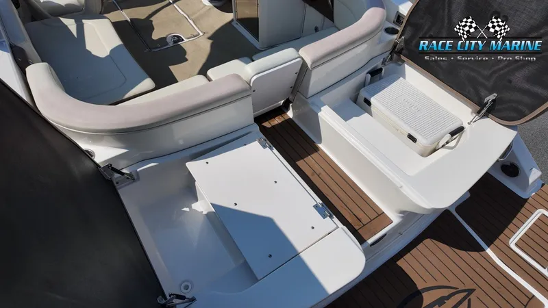 Slide: The Image of The image shows the cockpit of a 2015 Chaparral 277 SSX with seating and storage areas. - 13