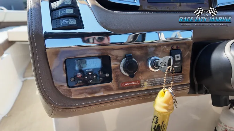 Slide: The Image of Close-up of a Chaparral 277 SSX boat dashboard with switches and ignition key. - 35