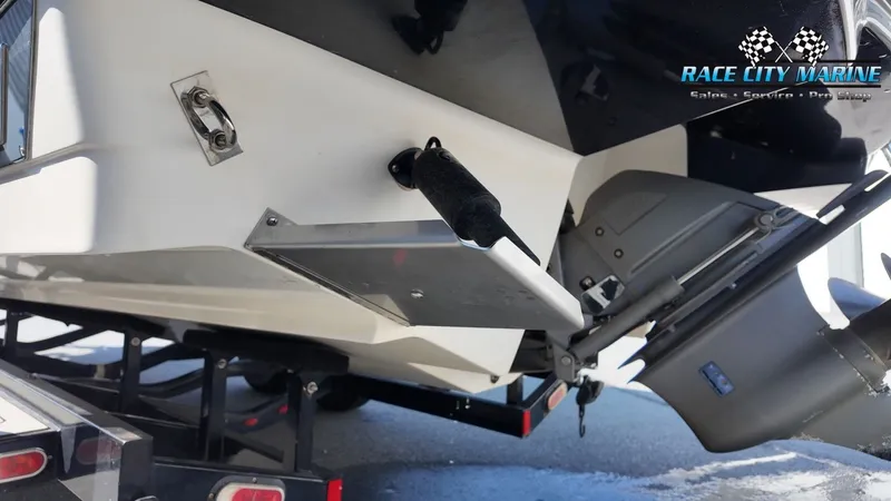 Slide: The Image of The image shows the stern of a 2015 Chaparral 277 SSX boat on a trailer. - 9