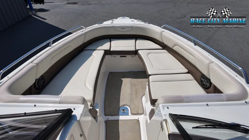 Slide: The Image of The image shows the bow seating area of a 2015 Chaparral 277 SSX with beige upholstery. - 37