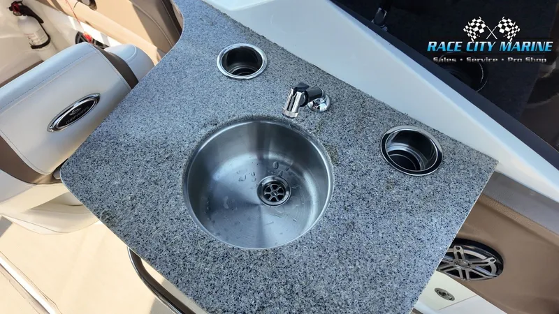Slide: The Image of Galley area with sink and granite countertop on a boat. - 32