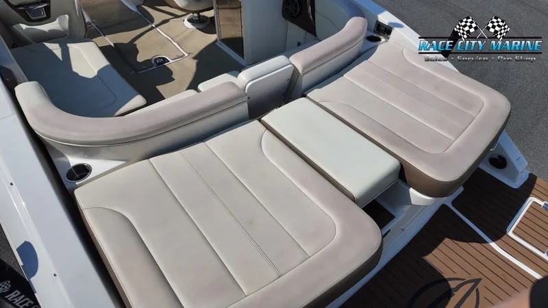 Slide: The Image of The image shows the cockpit of a 2015 Chaparral 277 SSX with beige upholstery. - 14
