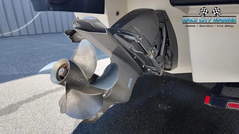 Slide: The Image of Close-up of a boat motor with propeller, taken in a parking lot. The boat is a 2015 Chaparral 277 SSX. - 10