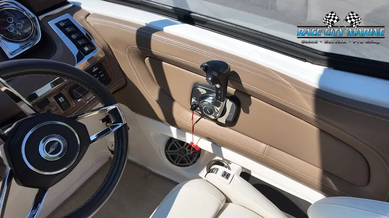 Slide: The Image of The image shows the cockpit of a 2015 Chaparral 277 SSX with a sleek steering wheel and controls. - 48