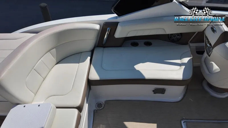 Slide: The Image of The image shows the cockpit of a Chaparral 277 SSX boat with beige upholstery and a helm console. - 23