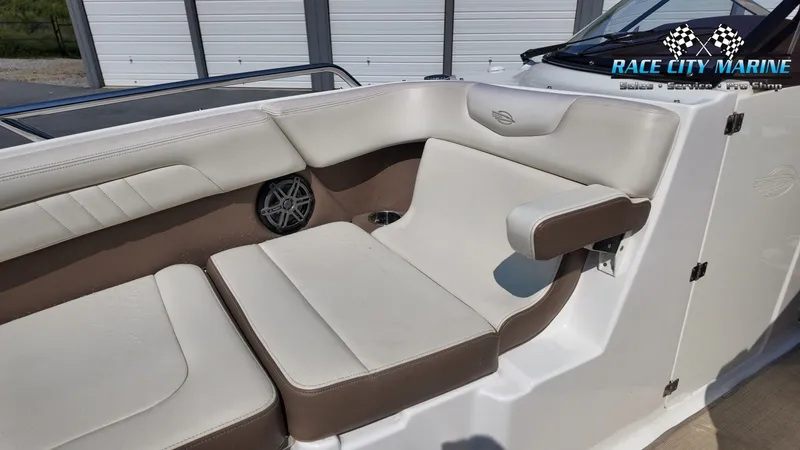 Slide: The Image of The interior of a 2015 Chaparral 277 SSX with beige and brown upholstery. - 41