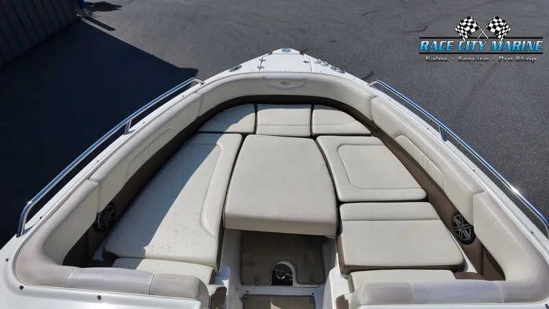 Slide: The Image of The image shows the bow area of a 2015 Chaparral 277 SSX boat with beige upholstery. - 34