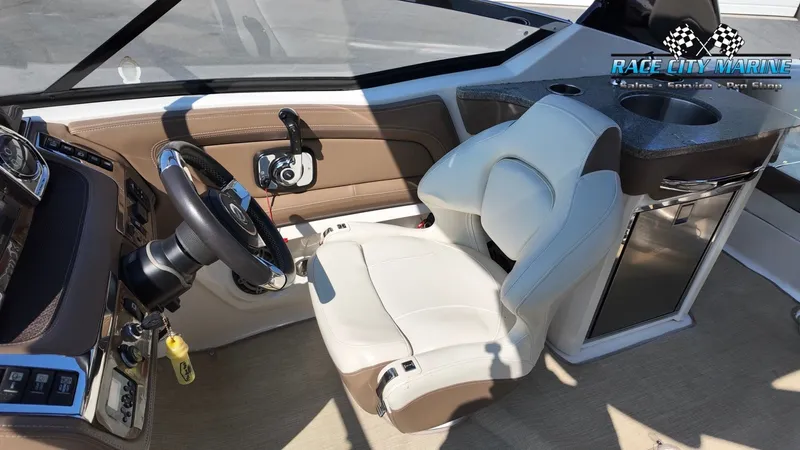 Slide: The Image of The image shows the cockpit of a 2015 Chaparral 277 SSX with a comfortable seat and steering. - 46