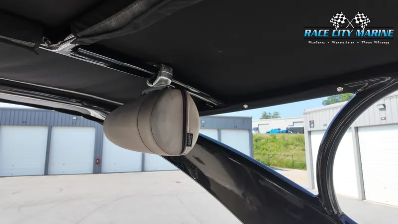 Slide: The Image of Interior view of a 2015 Chaparral 277 SSX with speaker and black canopy. - 24