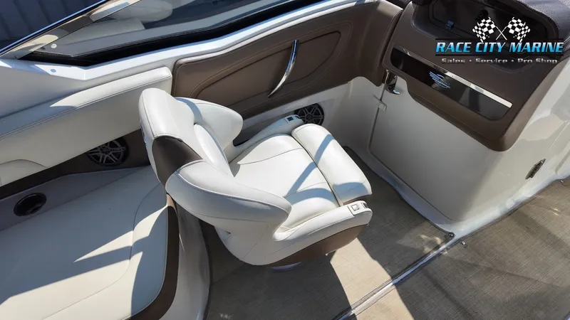 Slide: The Image of Interior view of a 2015 Chaparral 277 SSX with beige and brown upholstered seating. - 21