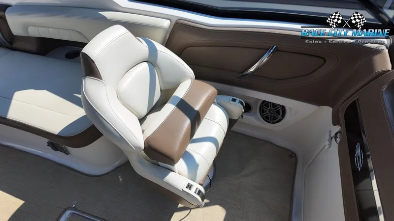Slide: The Image of Interior of a 2015 Chaparral 277 SSX with beige and brown seating. - 18