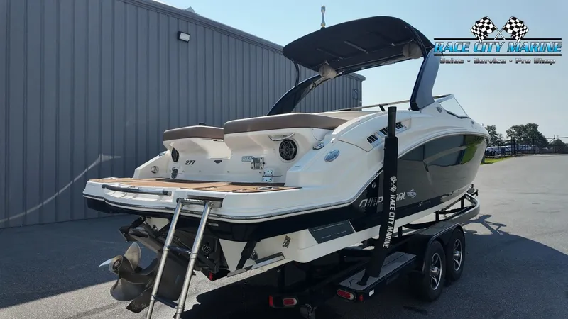 Slide: The Image of The image shows a 2015 Chaparral 277 SSX boat on a trailer, ready for transport. - 8