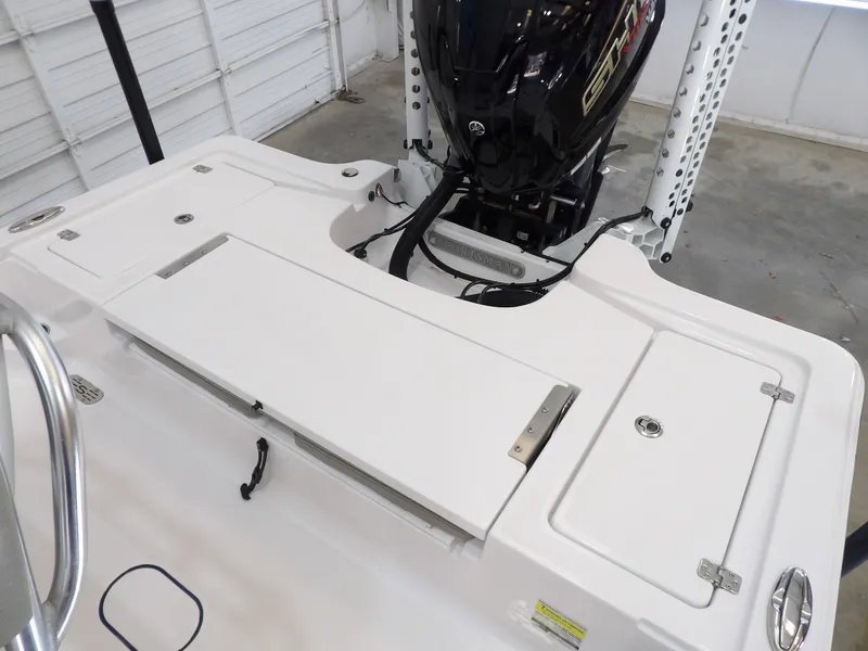 Slide: The Image of The image shows the stern of a 2022 Sportsman Tournament 214 Bay Boat with an outboard motor. - 18