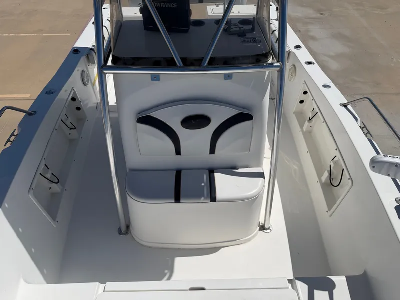 Slide: The Image of The image shows the cockpit of a 2002 PRO SPORT PRO KAT 2200 boat with seating and a helm console. - 17