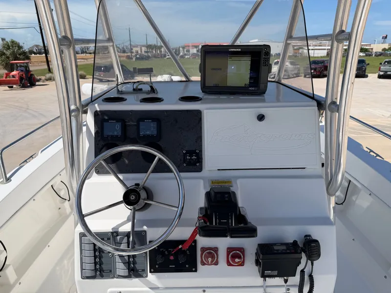 Slide: The Image of The image shows the helm of a 2002 PRO SPORT PRO KAT 2200 with navigation equipment. - 20