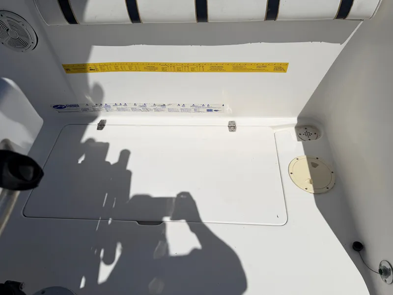Slide: The Image of The image shows the interior of a 2002 PRO SPORT PRO KAT 2200 boat with white surfaces. - 28
