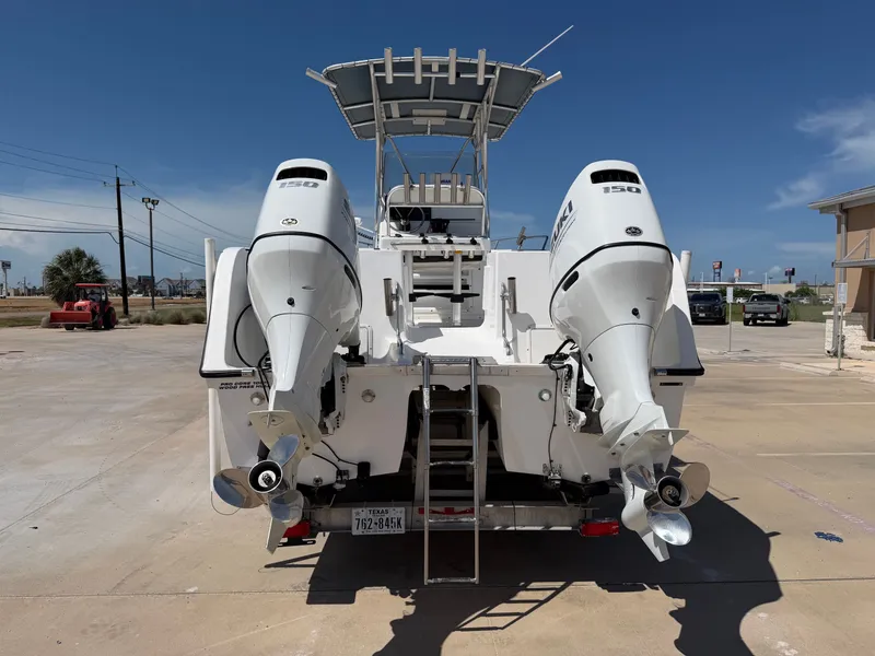 Slide: The Image of The image shows a 2002 PRO SPORT PRO KAT 2200 boat with two outboard engines. - 9