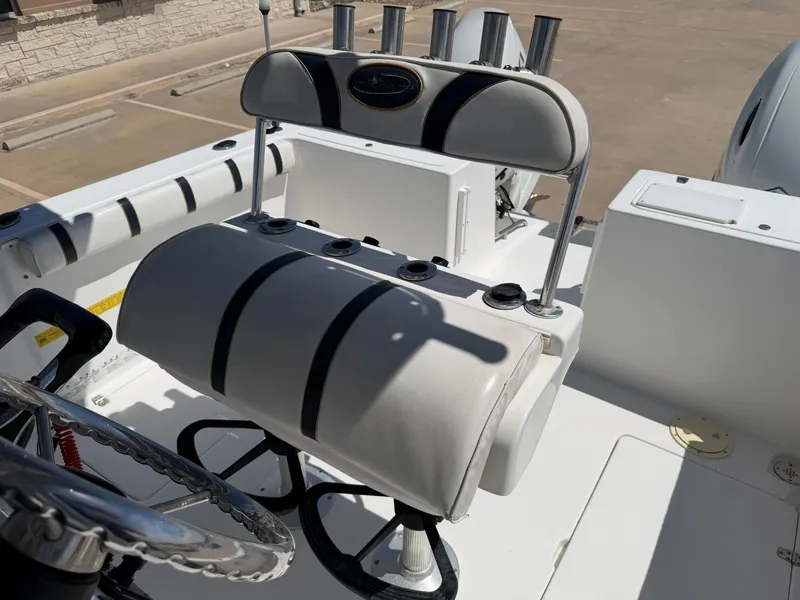 Slide: The Image of The image shows the helm of a 2002 PRO SPORT PRO KAT 2200 boat. - 23