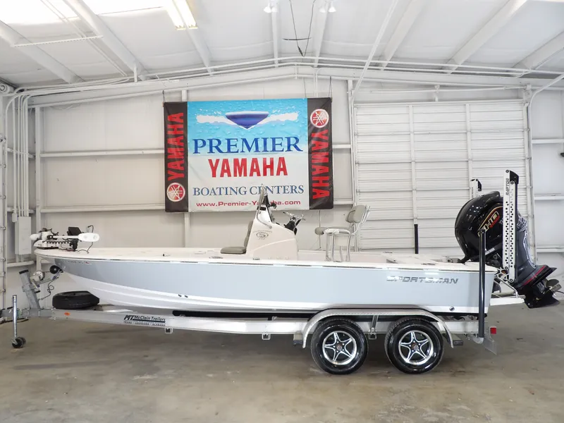 The Image of A 2022 Sportsman Tournament 214 Bay Boat on a trailer inside a showroom. - 1