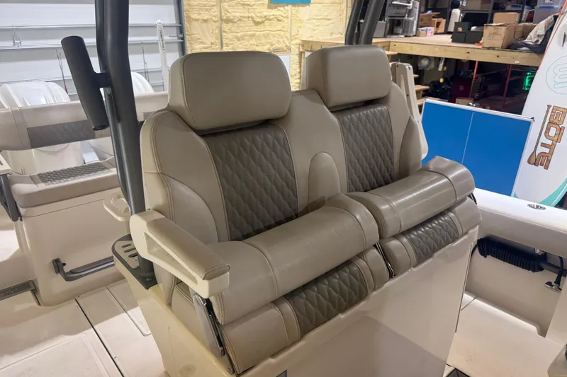 Slide: The Image of Luxurious seating on 2024 Solace 30HCS boat, featuring plush, quilted upholstery. - 17