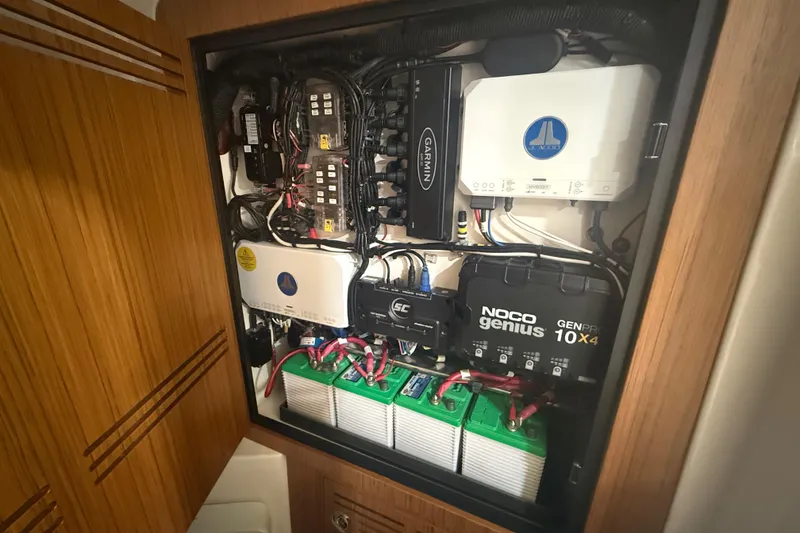 Slide: The Image of Electrical panel of 2024 Solace 30HCS boat with NOCO Genius charger and wiring. - 34