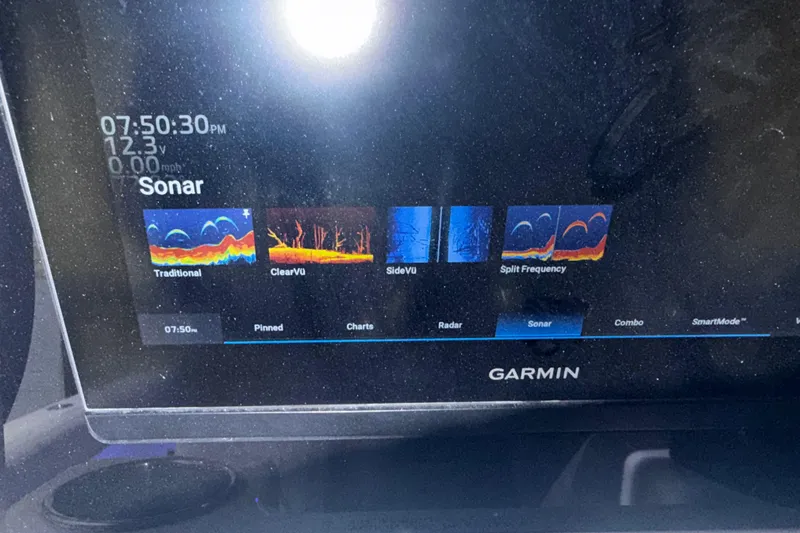 Slide: The Image of Garmin sonar display on 2024 Solace 30HCS boat, showing various sonar modes and settings. - 48