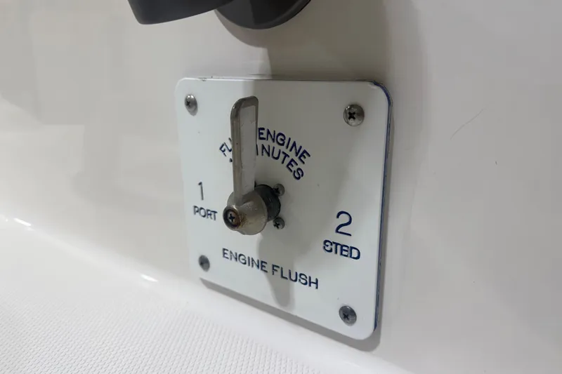 Slide: The Image of Engine flush control panel on 2024 Solace 30HCS boat, featuring port and starboard options. - 44