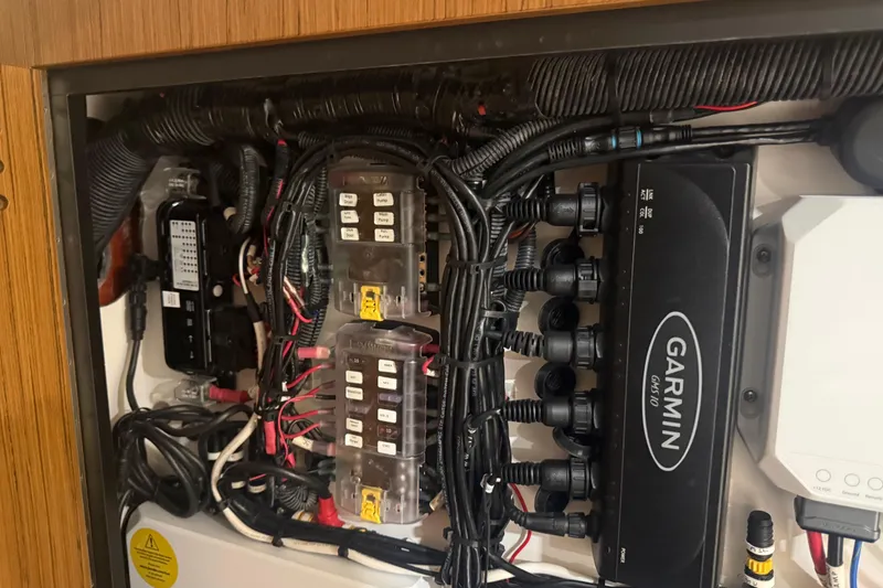 Slide: The Image of Electrical panel of 2024 Solace 30HCS boat with Garmin equipment and wiring. - 32