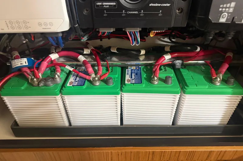 Slide: The Image of 2024 Solace 30HCS battery compartment with green-topped batteries and red cables. - 31