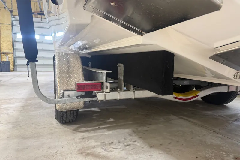 Slide: The Image of 2024 Solace 30HCS boat trailer detail in a garage setting. - 52
