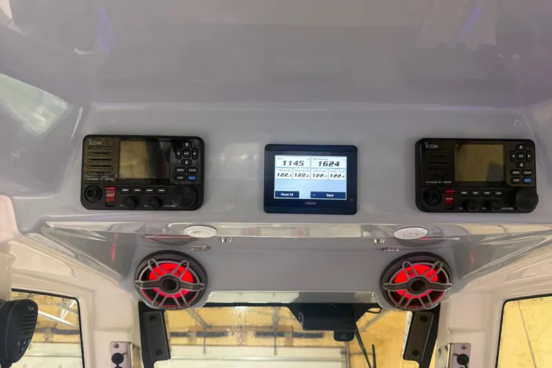 Slide: The Image of 2024 Solace 30HCS dashboard with Icom radios, Yamaha display, and red speakers. - 8