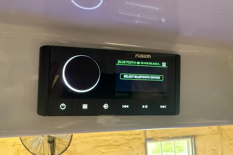 Slide: The Image of 2024 Solace 30HCS Bluetooth audio system display with control buttons. - 47