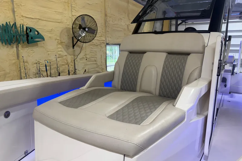 Slide: The Image of Luxurious seating on 2024 Solace 30HCS boat, featuring elegant design and comfortable upholstery. - 15